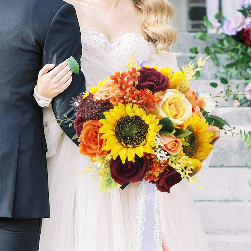 Bride and groom holding a vibrant bouquet of artificial sunflowers, roses, and other flowers.