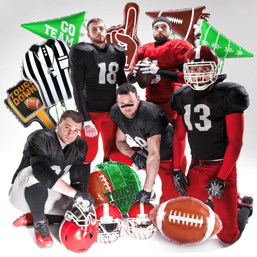 Group of men in football uniforms with various football-themed balloons and helmets