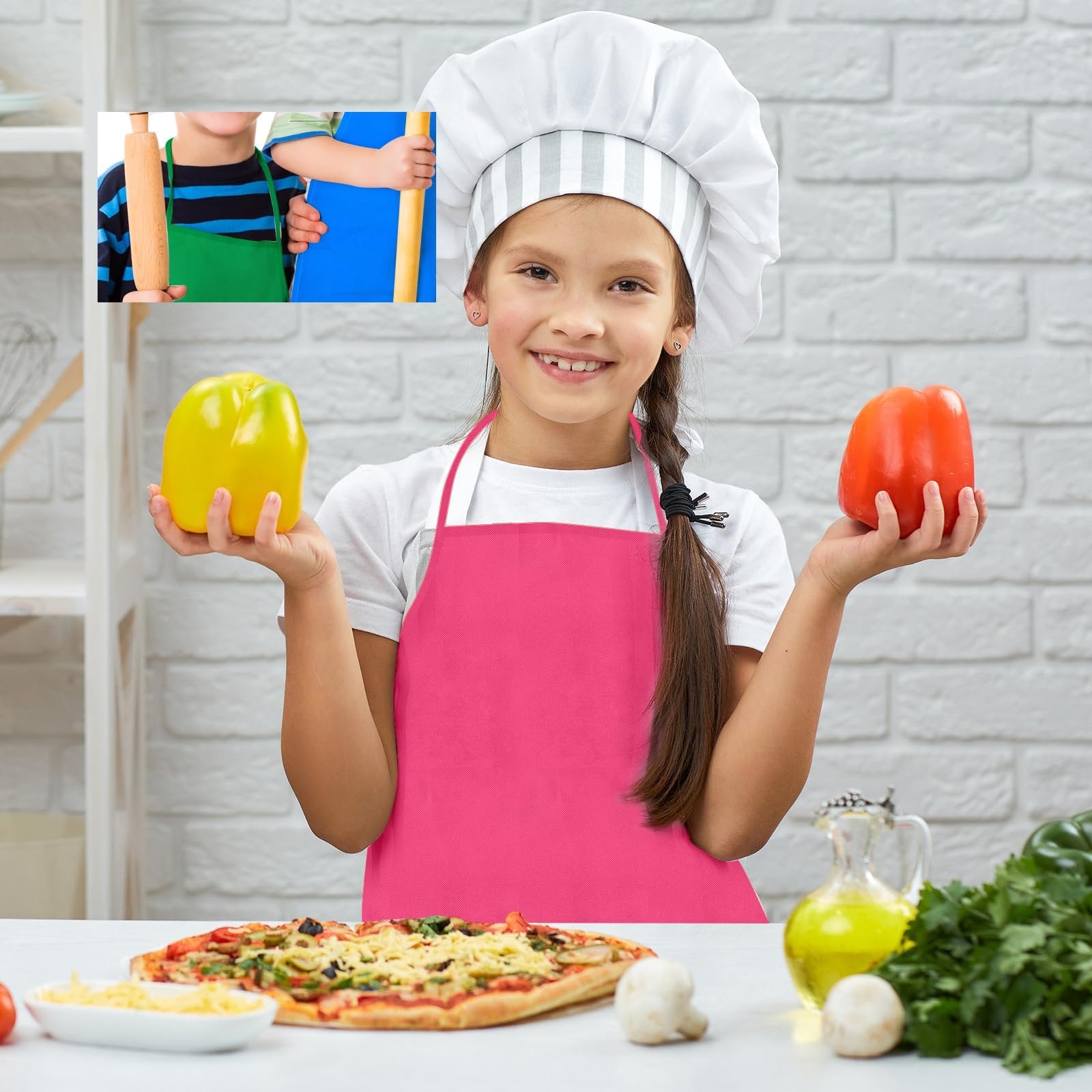Smiling girl in chef hat and pink apron holding yellow and red bell peppers, with pizza and ingredients on table