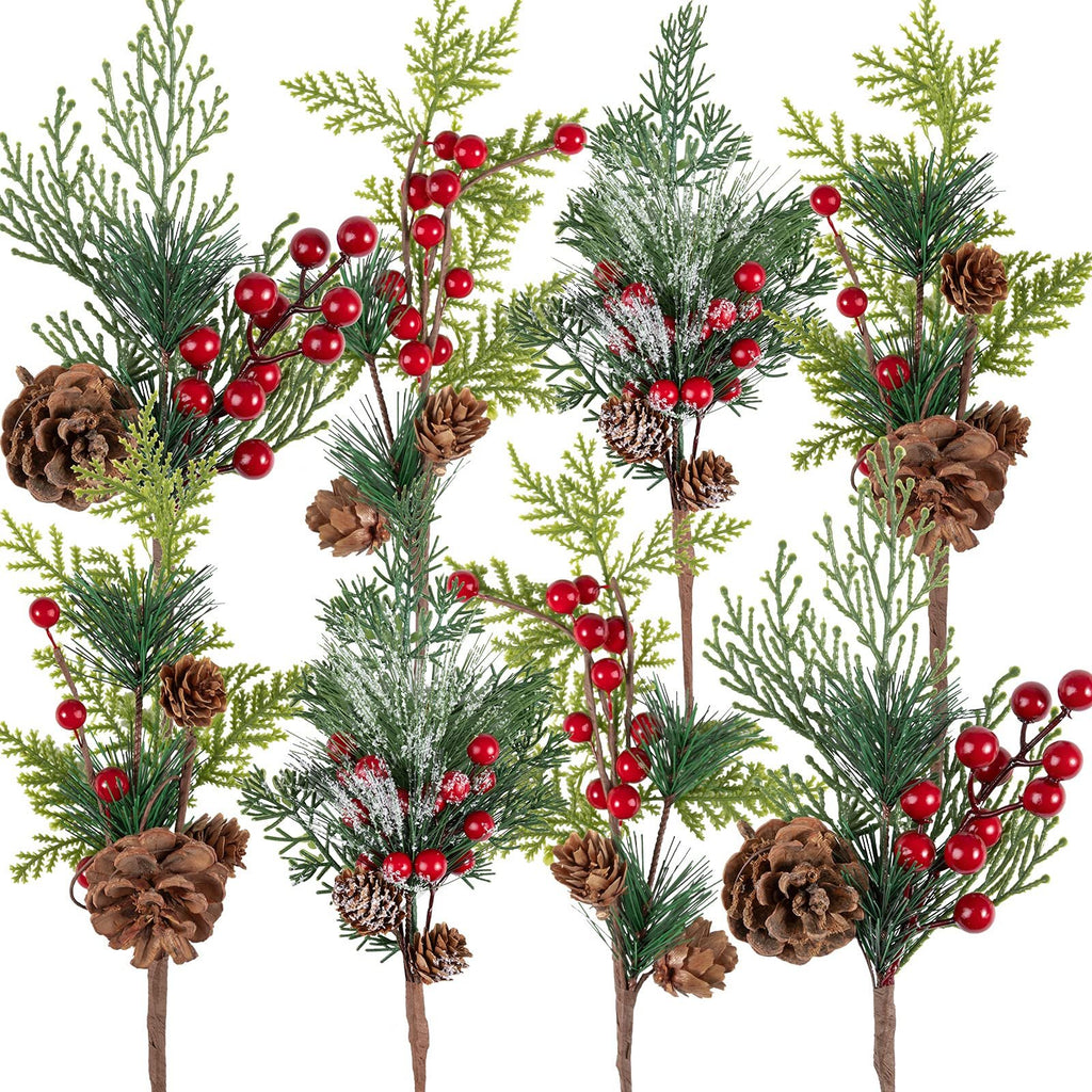Eight artificial Christmas pine sprigs with red berries and pine cones, arranged in a collage against a white background.