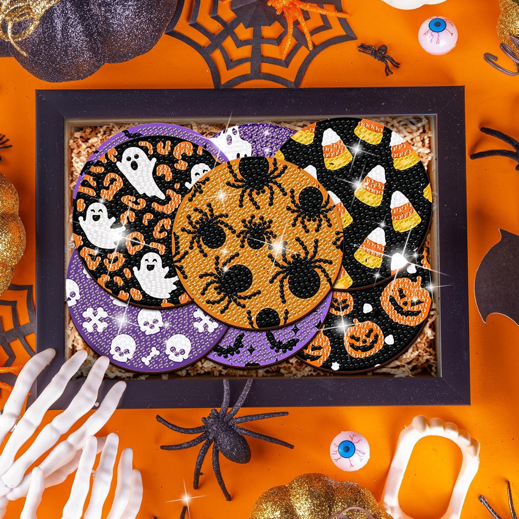 Halloween diamond art coaster kit with ghost, spider, candy corn, and pumpkin designs inside a black frame.