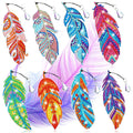 Eight colorful diamond painting feather bookmarks with crystal charms, displayed against a soft purple feather background.