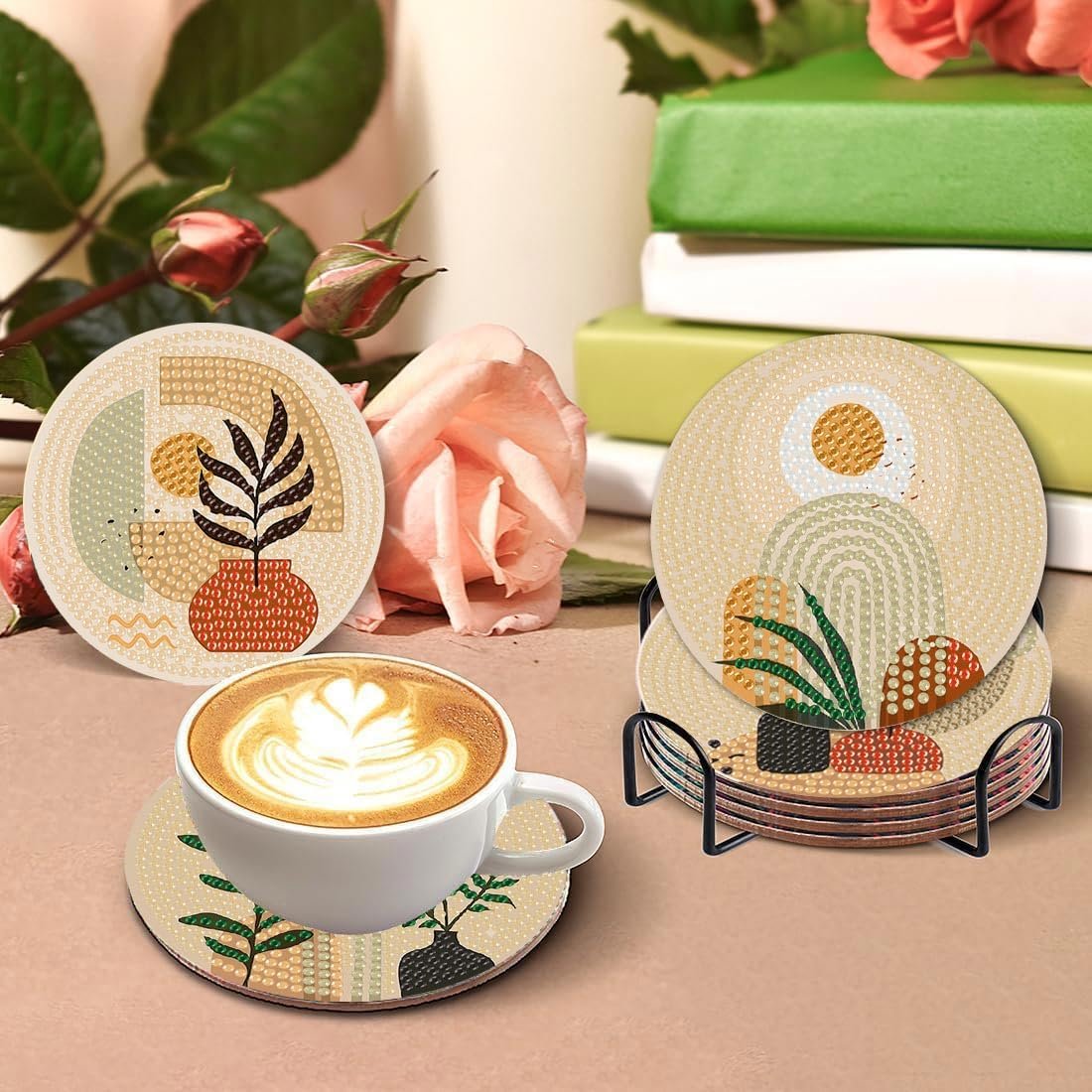 Bohemian style diamond art coasters with abstract landscape designs displayed with a cup of coffee and roses.