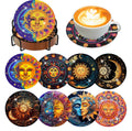 Diamond art coasters with sun and moon designs in a holder and one under a coffee cup