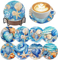 Set of 8 ocean-themed diamond art coasters with holder and a coffee cup on one coaster
