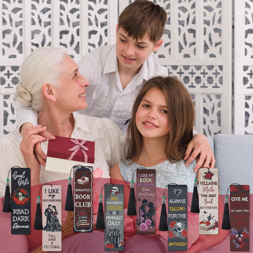 Grandmother and two grandchildren looking at diamond art bookmarks with gothic romance themes