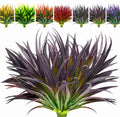 Close-up of a dark purple artificial grass plant with green stems, surrounded by smaller images of the same plant in various colors.