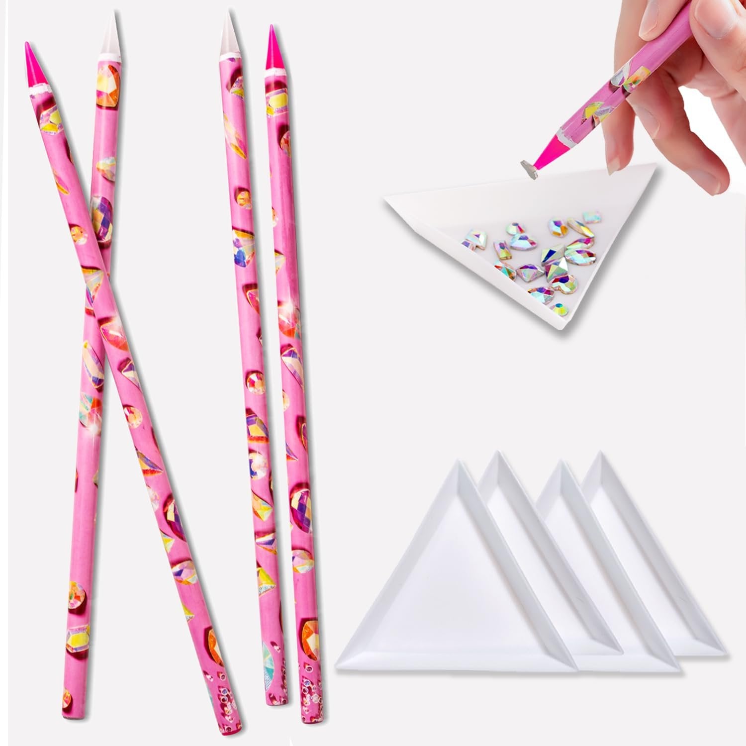 Pink rhinestone picker tools and white sorting trays with colorful rhinestones