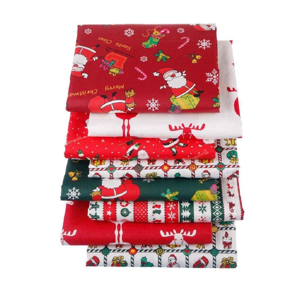 Stack of eight Christmas-themed cotton fat quarter fabric squares with Santa, reindeer, and snowflakes.