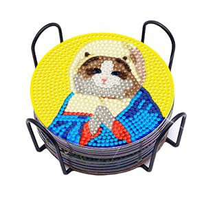 Diamond painting cat coasters stacked in a black metal holder, one coaster with a cat design is on top.