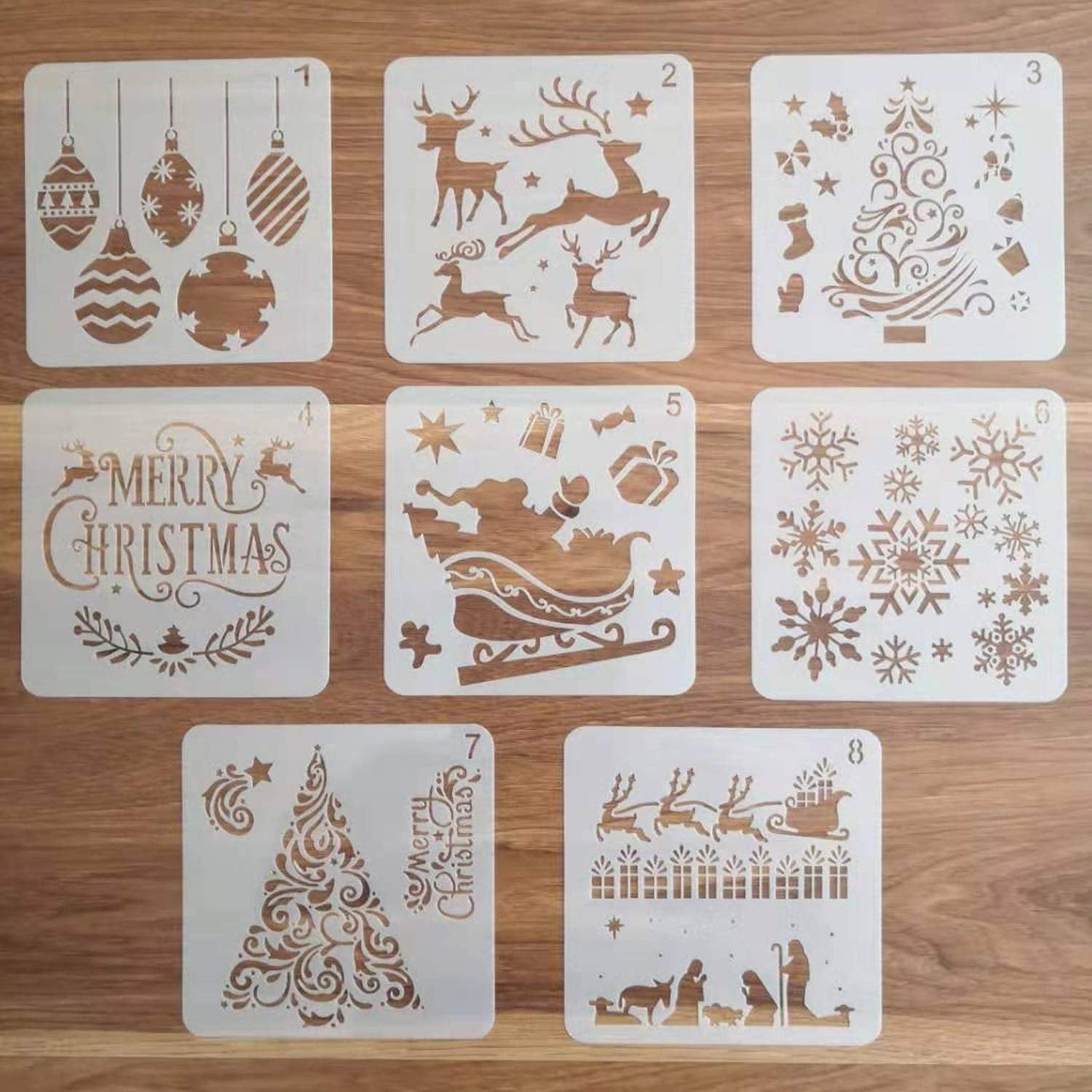 Set of 8 Christmas-themed stencils with designs including ornaments, reindeer, Santa's sleigh, snowflakes, Christmas trees, and nativity scene.