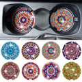 Diamond painting car coasters with mandala designs in a car's cup holder and arranged in a grid
