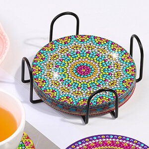 Eight-piece mandala diamond painting coaster kit with cork bases and holder, coasters stacked in black metal stand.
