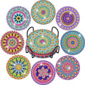 Eight colorful mandala diamond painting coasters displayed with a black metal holder in the center.