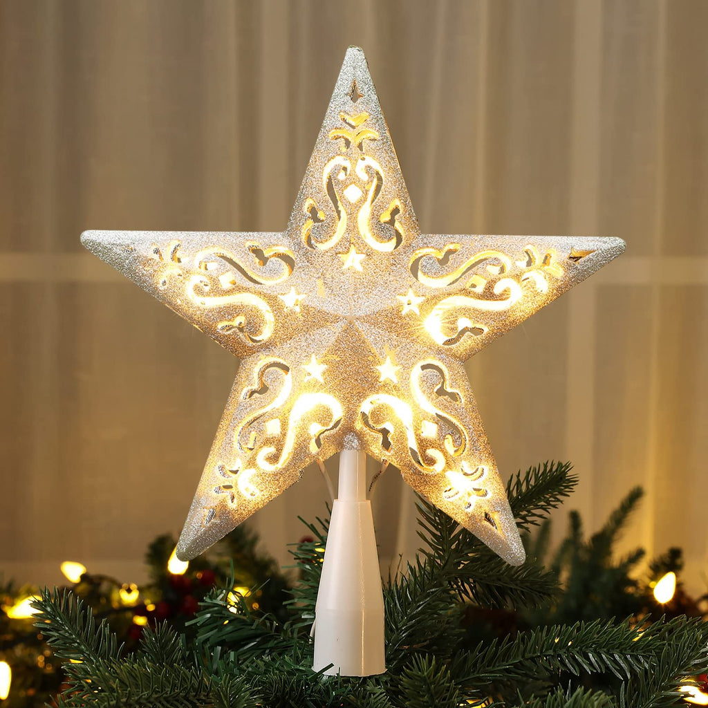 Glittered star Christmas tree topper with warm white lights, placed on a decorated tree.