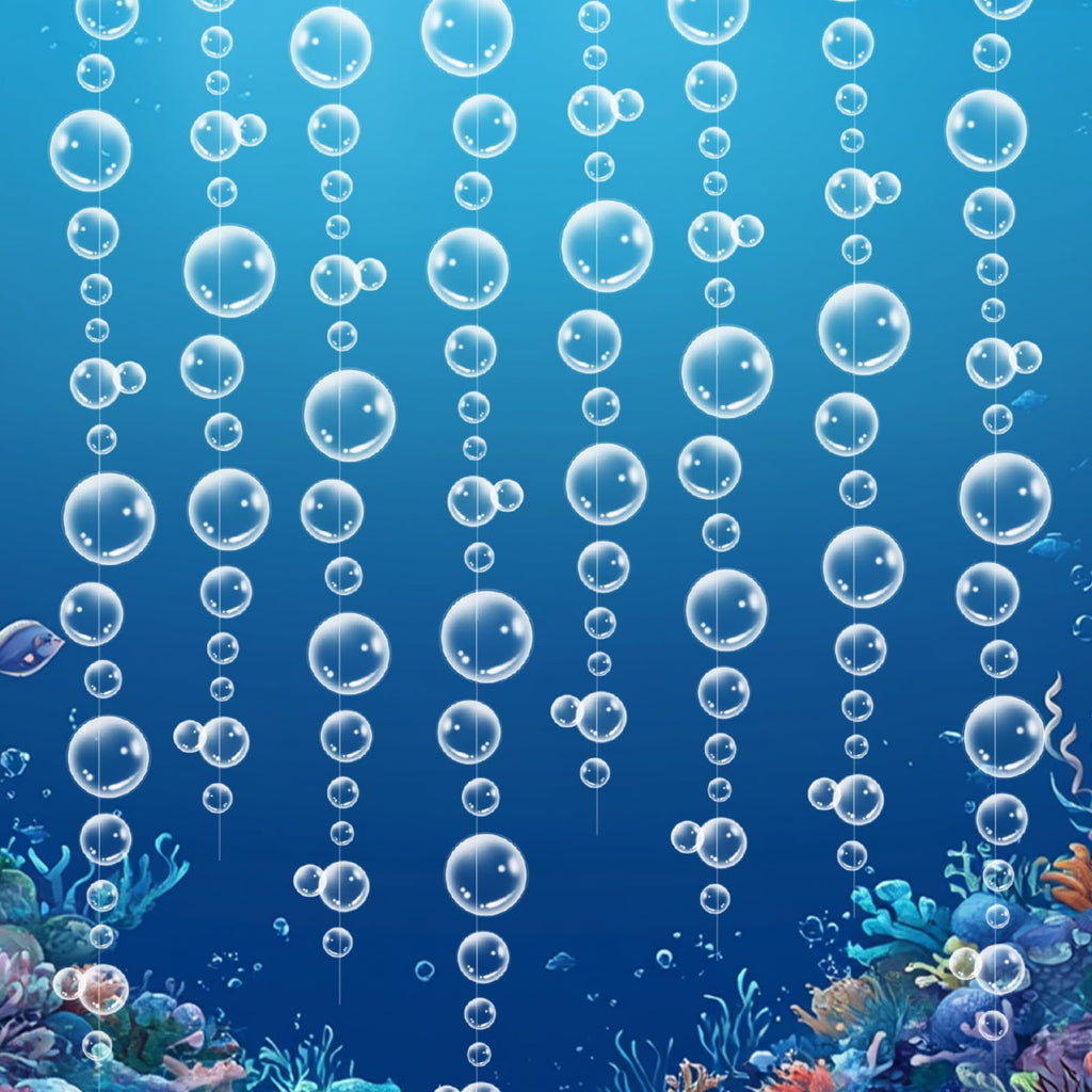 Underwater scene with multiple strands of clear bubble garland hanging against a blue background with coral and fish.