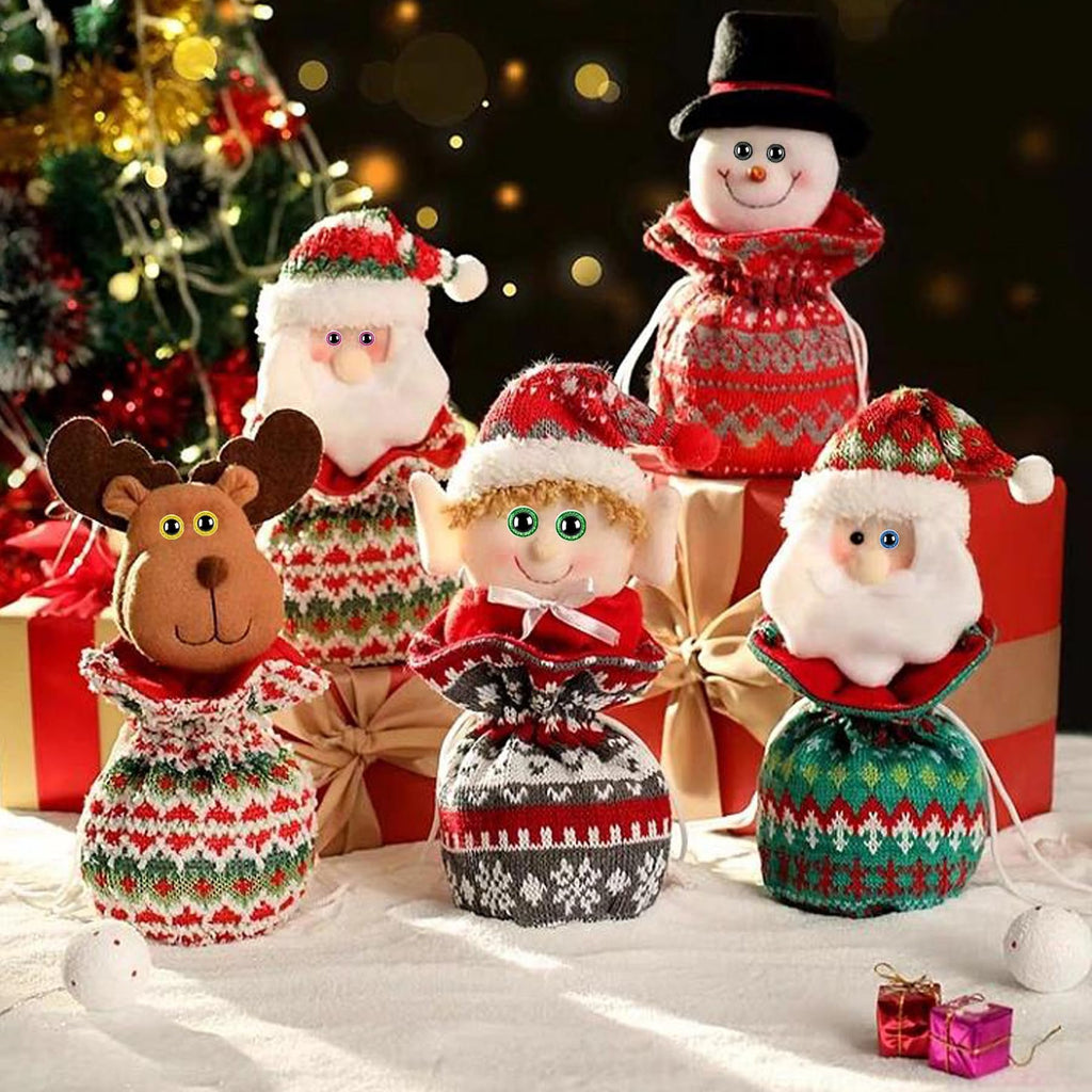 Christmas character gift bags including Santa, reindeer, elf, and snowman, arranged on a snowy surface with gift boxes and a Christmas tree in the background.