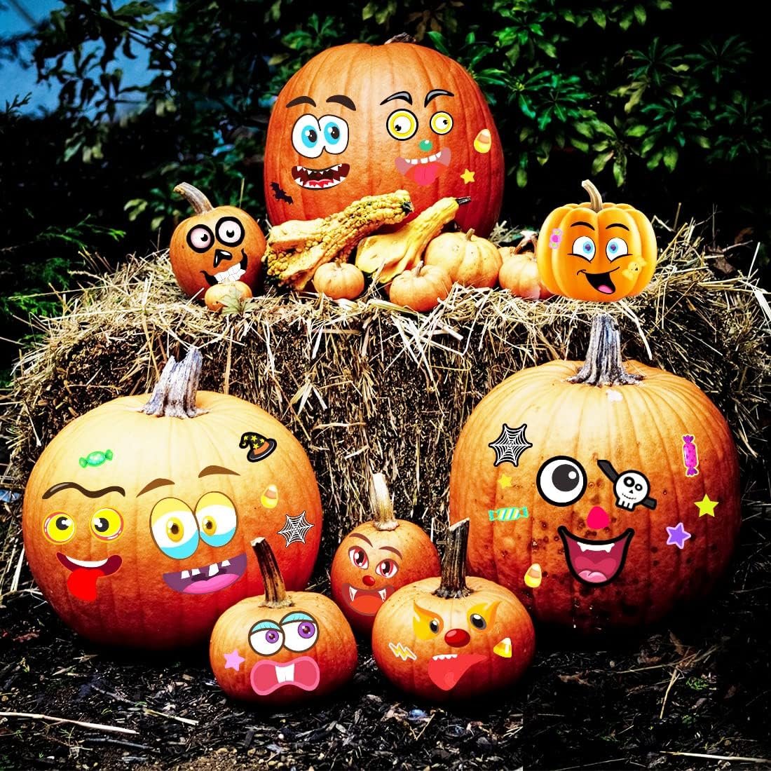 Assortment of pumpkins decorated with various cartoon face stickers on a hay bale outdoors.