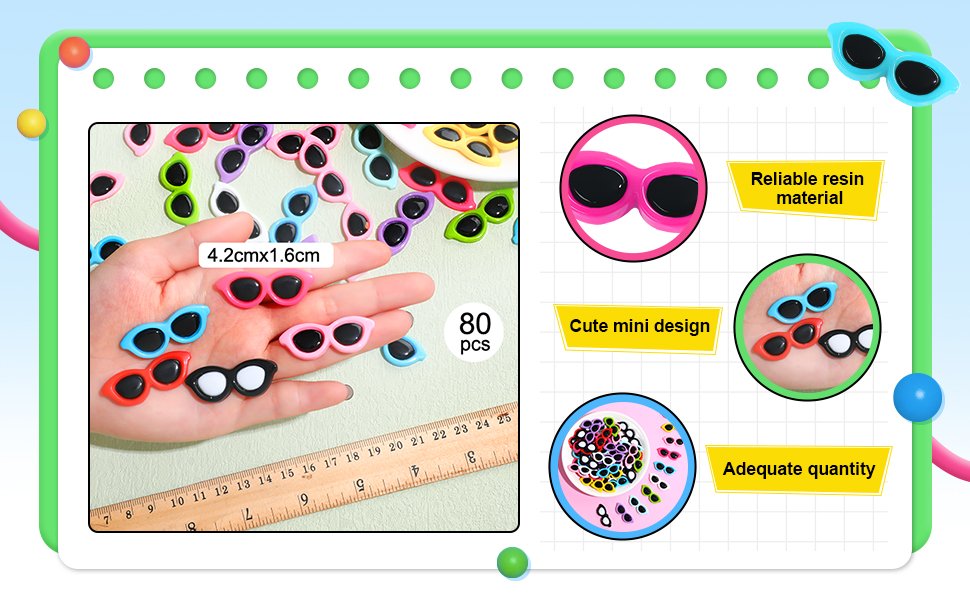 Miniature resin sunglasses charms in various colors held in a hand with a ruler for scale.
