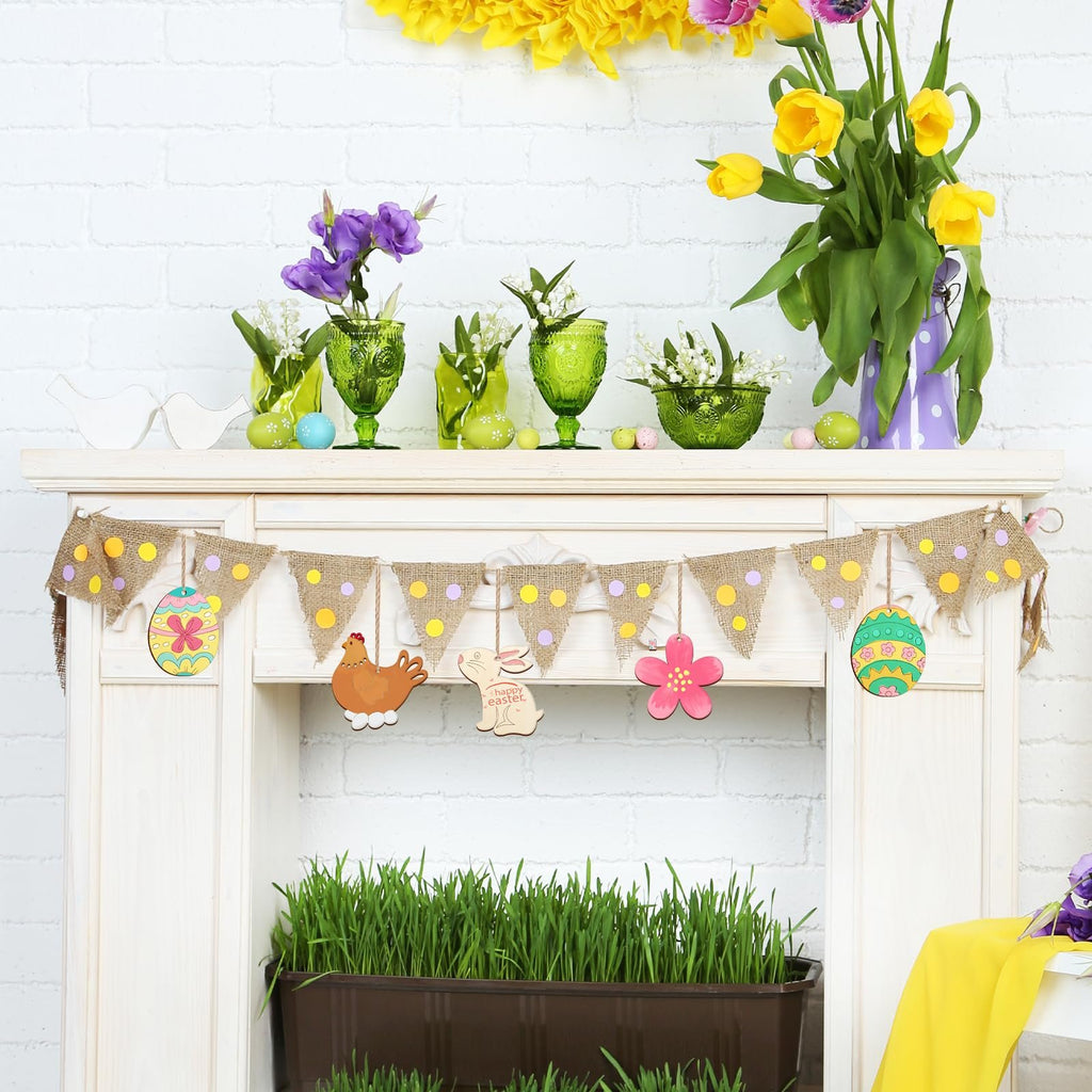 Easter bunny and chicken wooden cutouts hanging on a burlap banner with polka dots, displayed on a mantelpiece with flowers and Easter eggs.