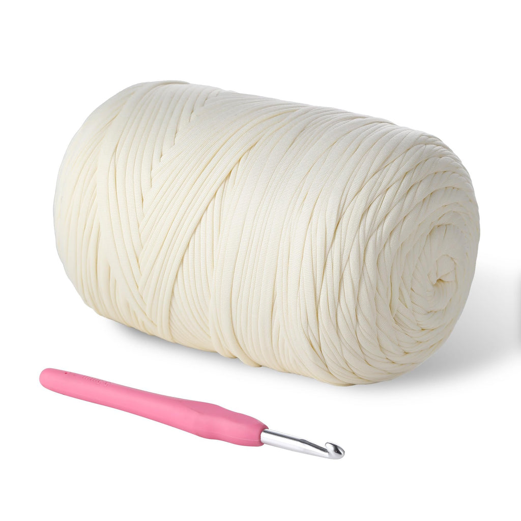 Milky white t-shirt yarn on a white background with a pink crochet hook