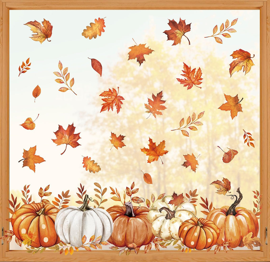 Autumn window clings featuring pumpkins and fall leaves, arranged on a window with a blurred forest background.