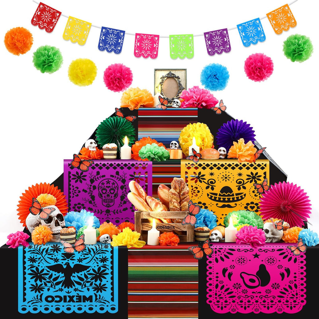 Day of the Dead altar decorations including paper flowers, banners, LED candles, skulls, and butterflies.