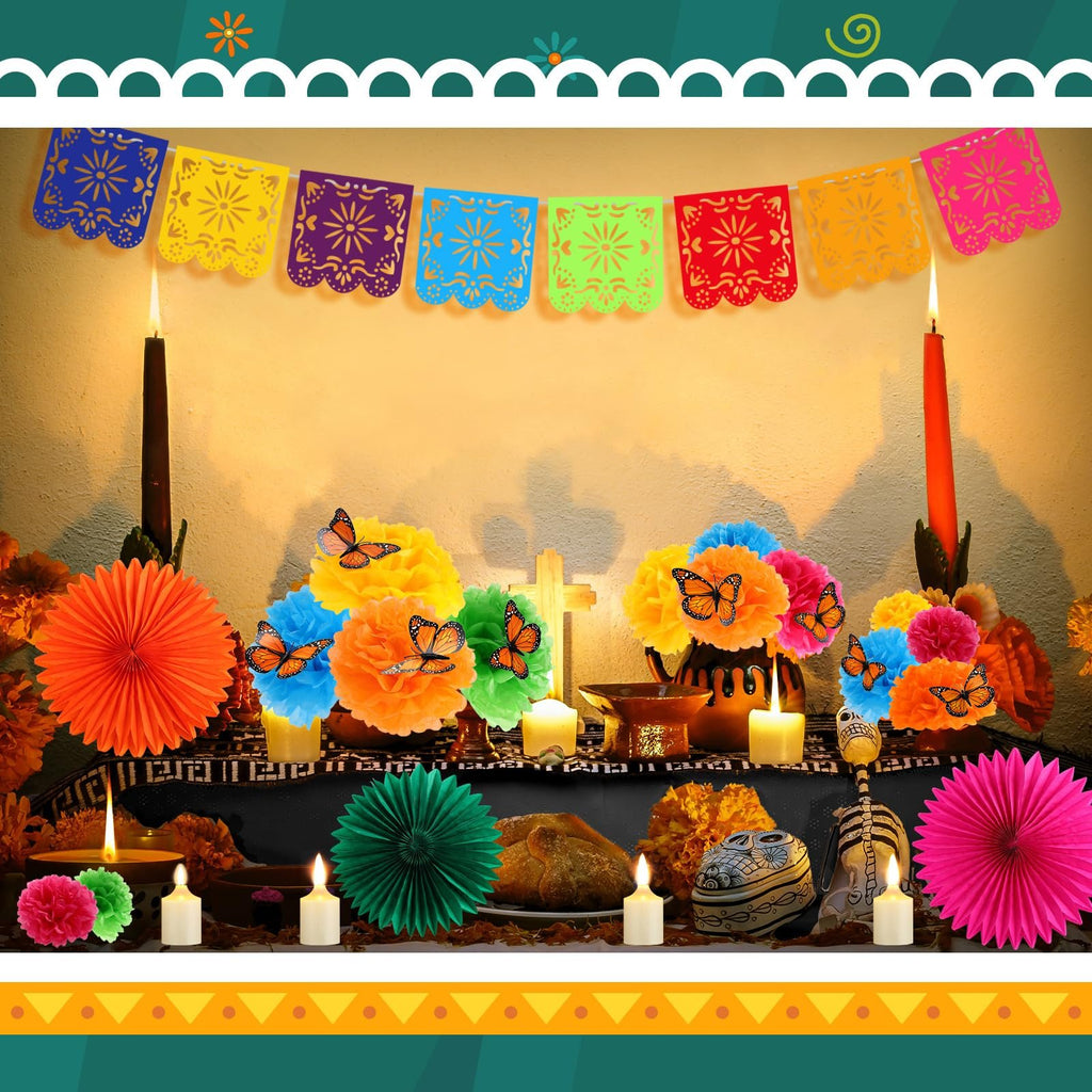 Day of the Dead altar setup with paper flowers, banners, LED candles, and decorative butterflies.