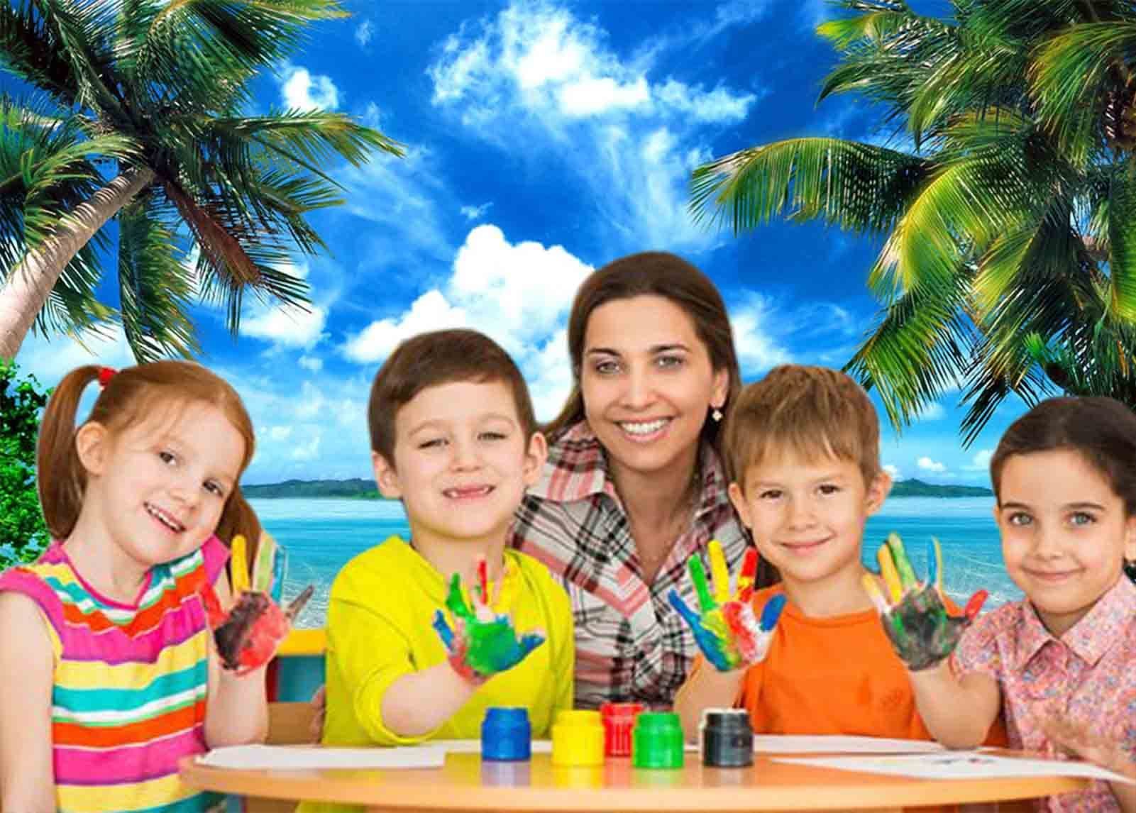 Children and teacher with painted hands smiling in front of a tropical beach backdrop