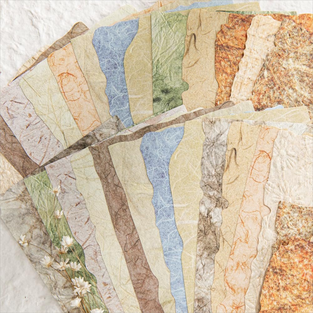 Fan of textured scrapbook paper sheets with deckled edges in various vintage colors and patterns.
