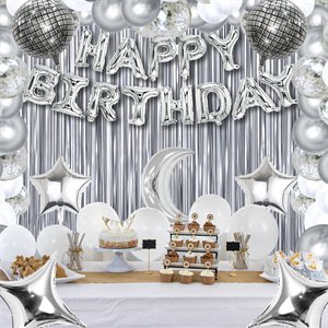 Silver and white birthday party decorations including foil balloons, star balloons, crescent moon balloon, and a 'Happy Birthday' banner.