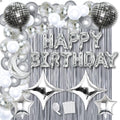 Silver and white balloons, disco balls, moon, stars, and fringe backdrop with 'Happy Birthday' foil balloons.