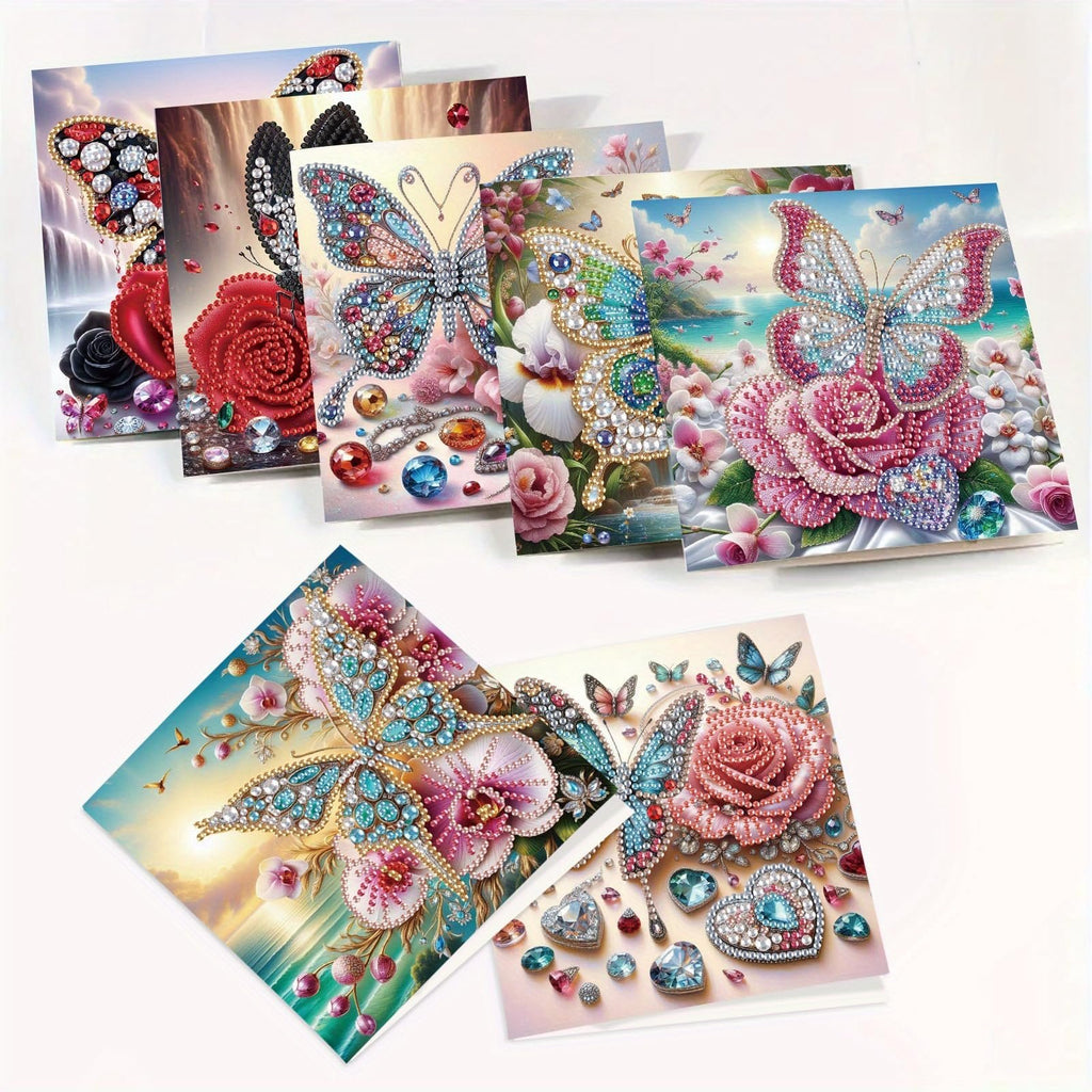 Collection of 5D diamond art greeting cards featuring butterflies and roses, some with gemstones and waterfalls.
