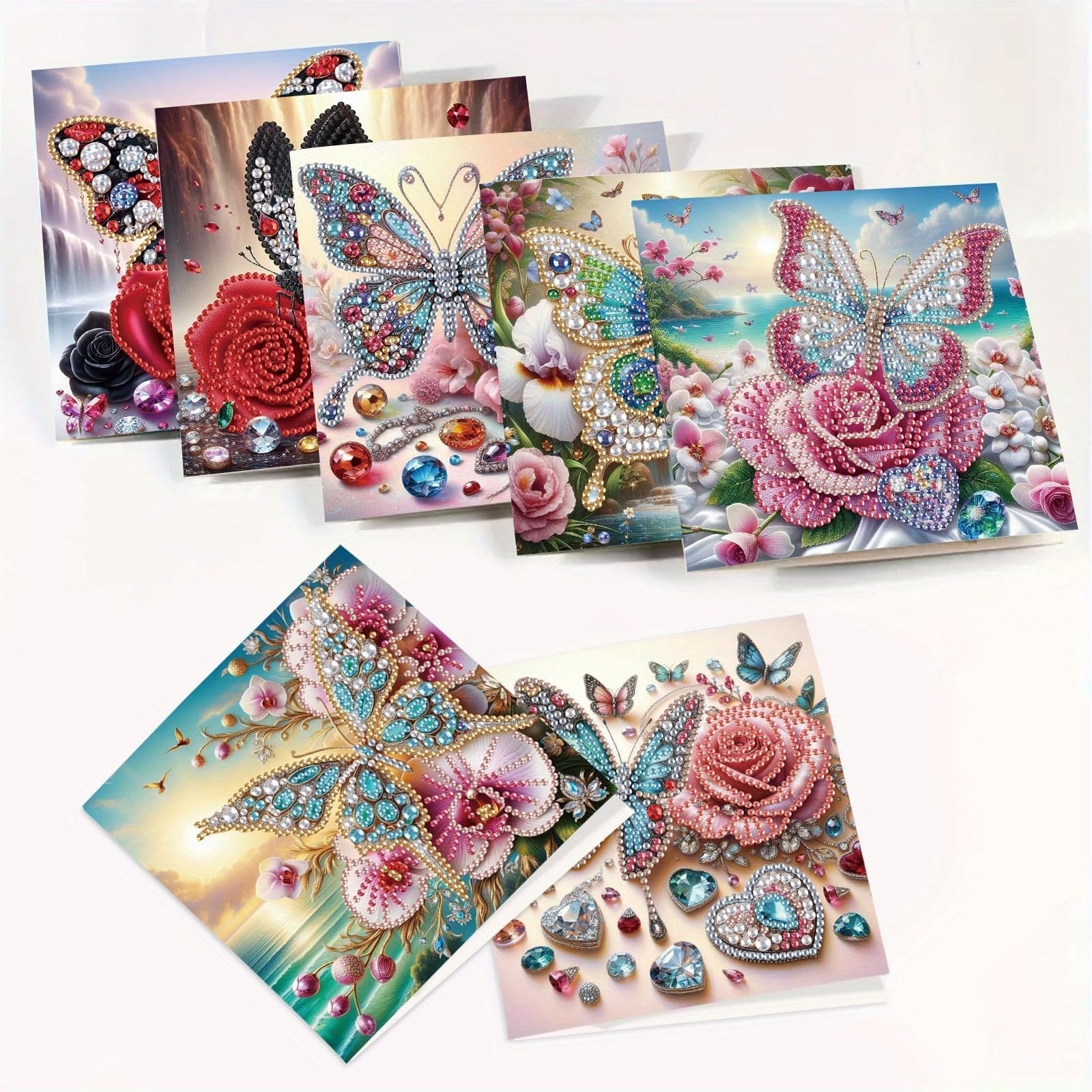 Collection of 5D diamond art greeting cards featuring butterflies and roses, some with gemstones and waterfalls.