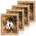 Four rustic brown picture frames layered diagonally, each showing a couple lying in dry grass with apples.