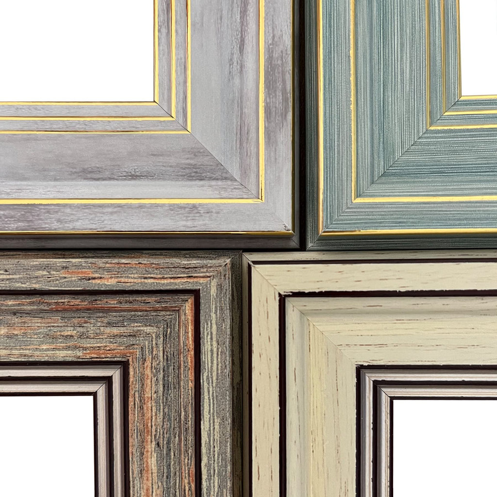 Four rustic farmhouse picture frames in grey, blue, brown, and cream colors with gold trim, shown from the corner.