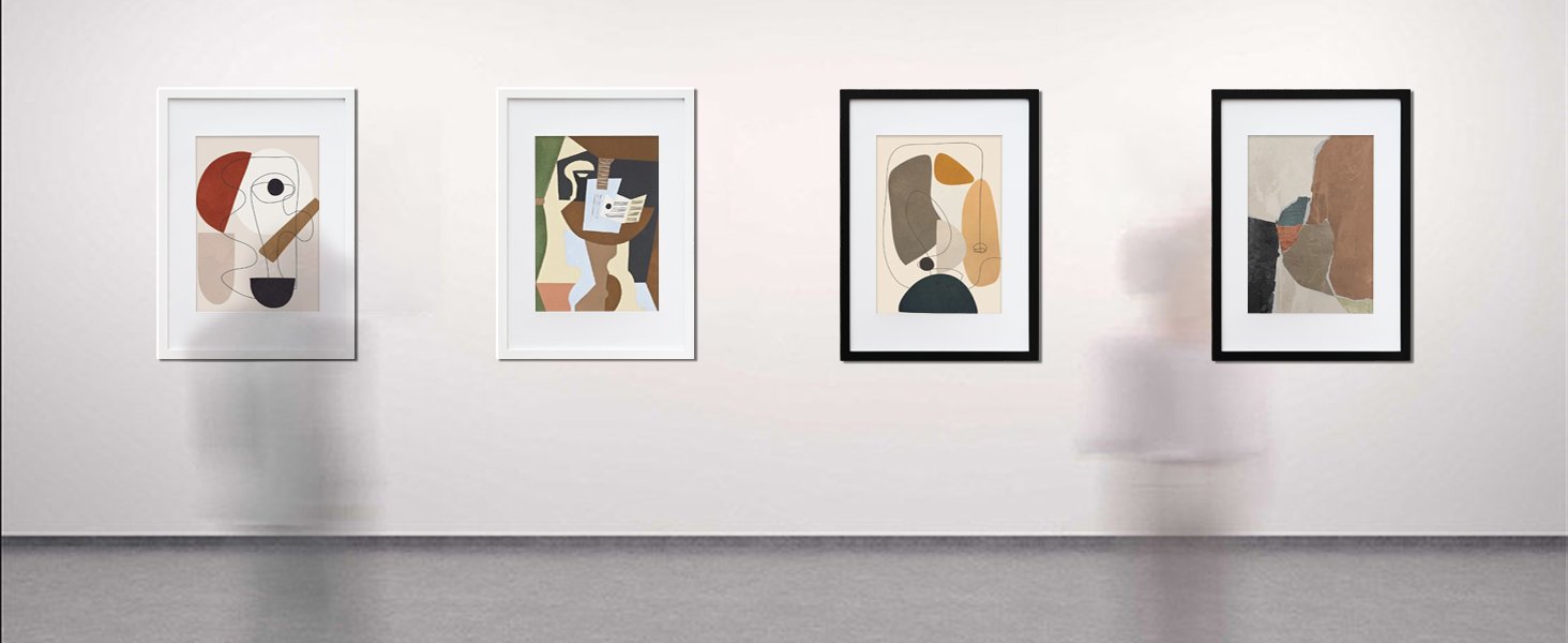 Four framed abstract art prints displayed on a white wall, two with white frames and two with black frames.