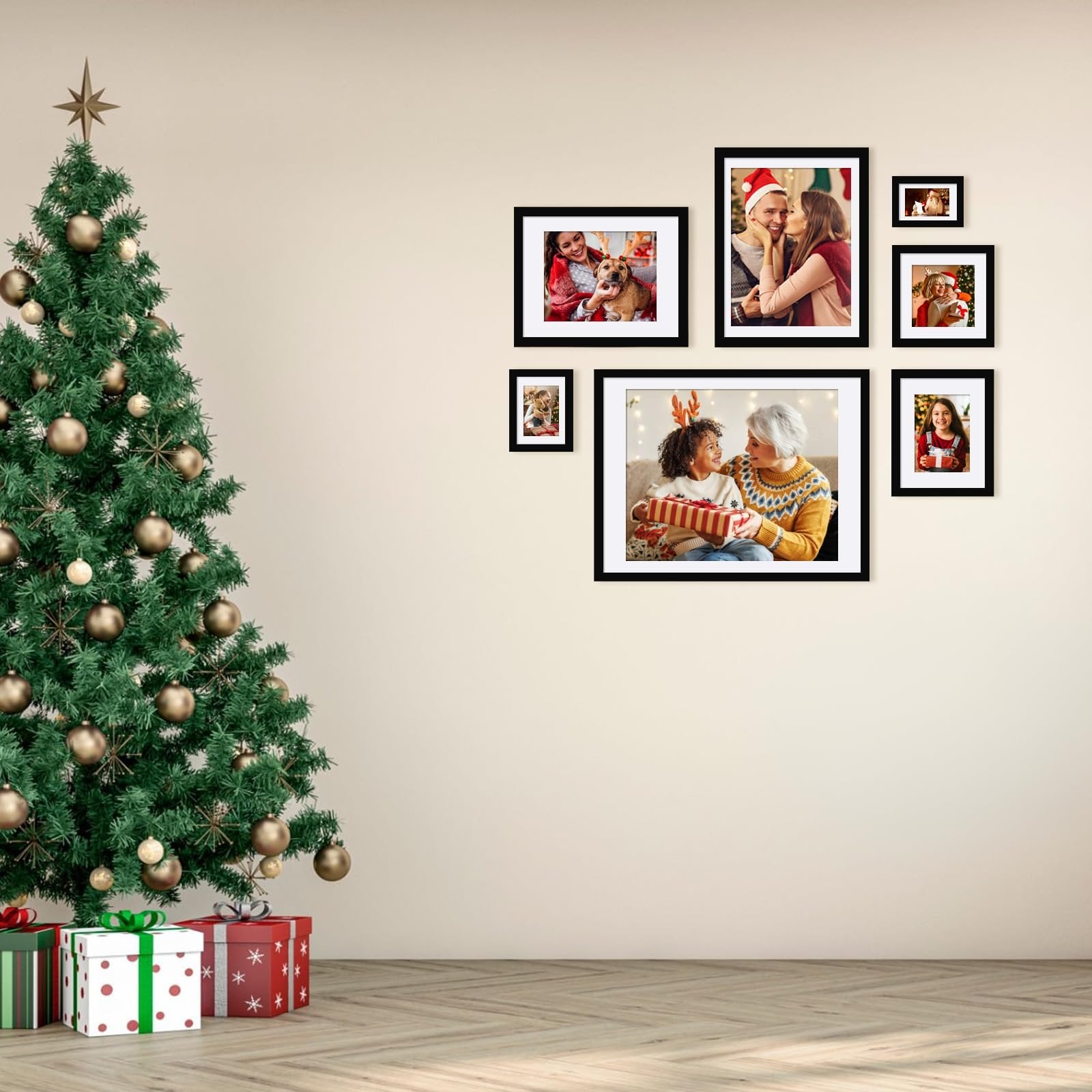 Gallery wall of black picture frames displaying Christmas photos next to a decorated tree and gifts.