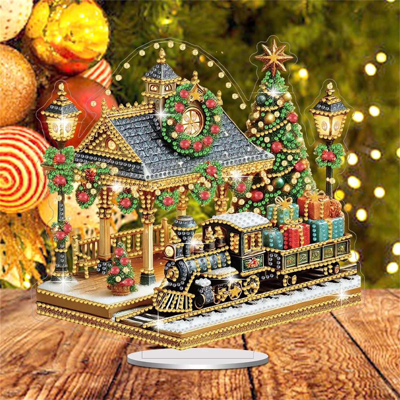 Diamond art painting kit of a Christmas train station with a train, decorated Christmas tree, and festive lights.