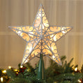 Illuminated 3D star tree topper with silver glitter filigree, placed on a Christmas tree.