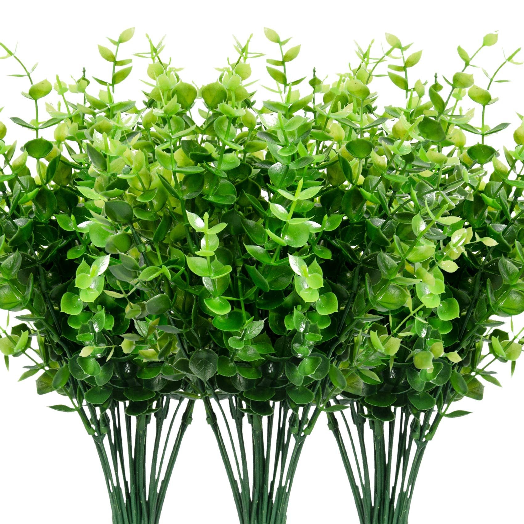 Bundles of artificial boxwood greenery with plastic stems on a white background.