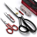 Set of fabric scissors, detail scissors, and measuring tape on a white background. The large scissors have black handles.