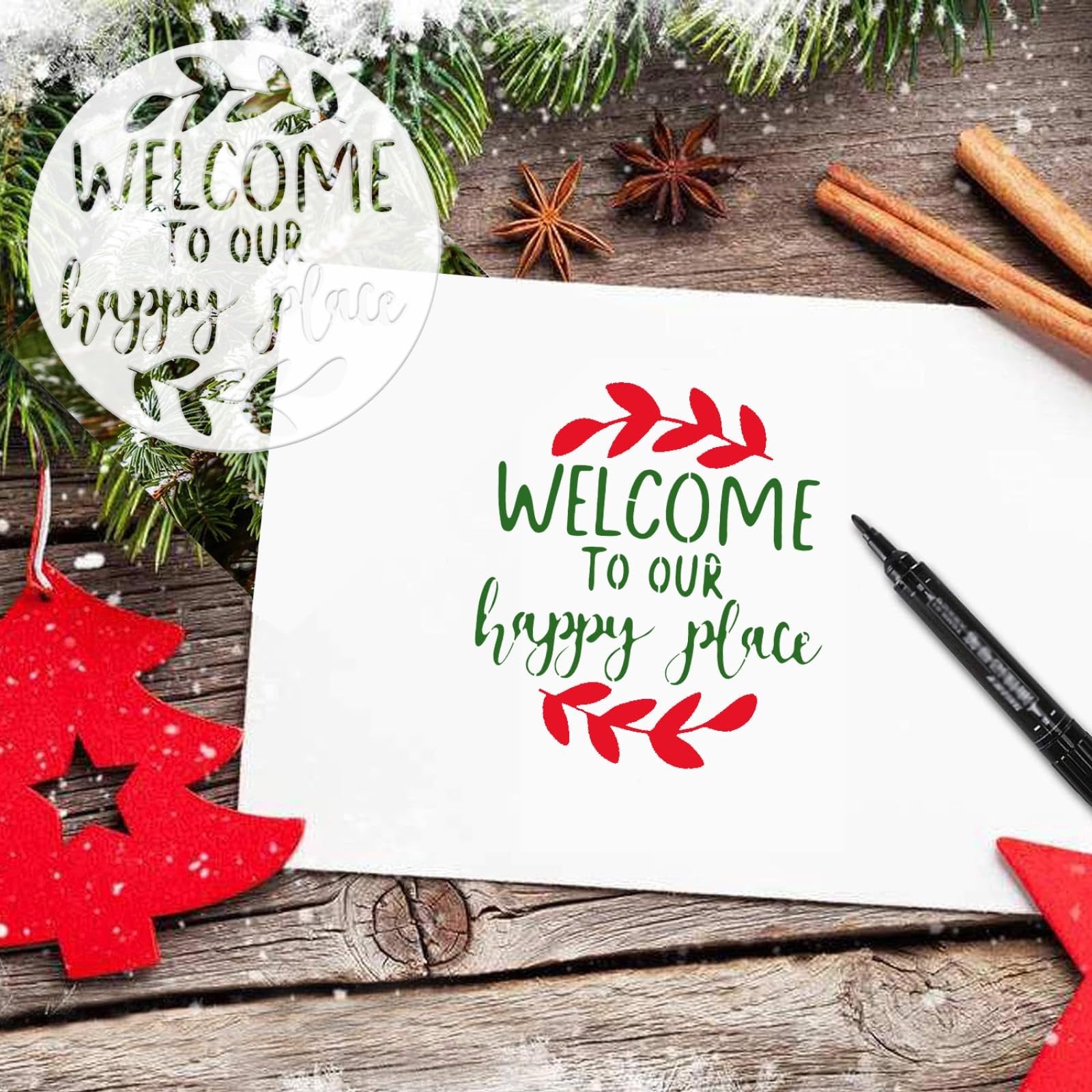 Round stencil with WELCOME TO OUR happy place design, shown on a wooden table with pine branches and cinnamon sticks.