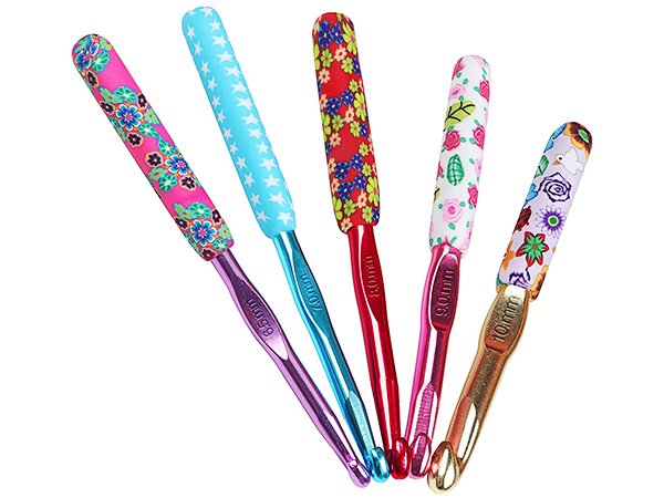 Set of five colorful crochet hooks with ergonomic soft grips and metallic shafts, showing sizes 6.5mm to 10mm.
