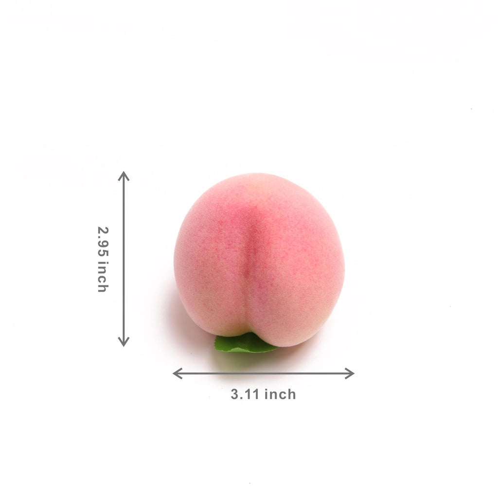 Single artificial pink peach with green leaf, showing dimensions 2.95 inches tall and 3.11 inches wide.
