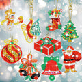 Collection of 9 diamond art Christmas ornament keychains including Santa, snowman, tree, stocking, gift box, bell, bauble, and candy cane shapes.