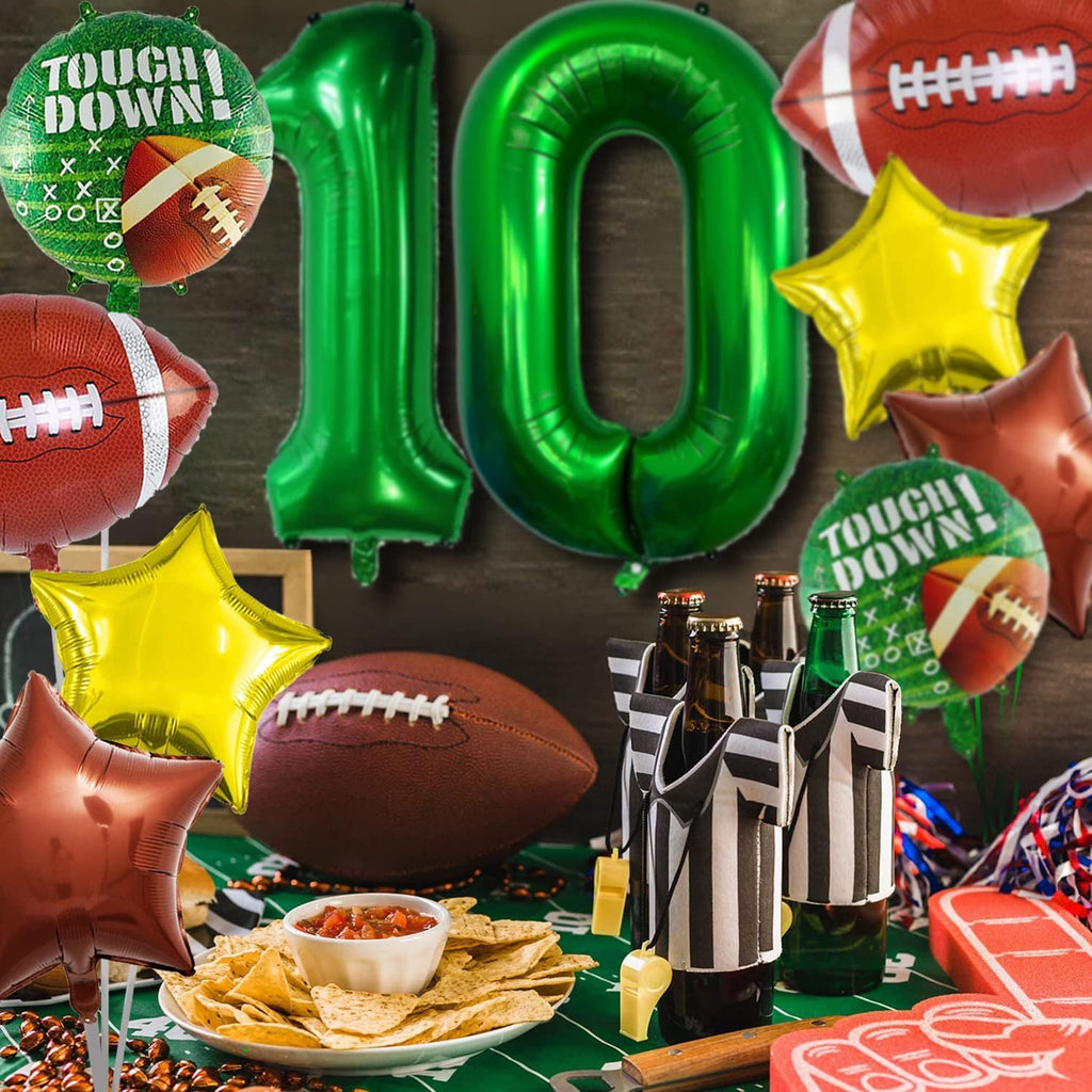 Football themed party decorations including balloons, footballs, nachos, and referee bottle holders.