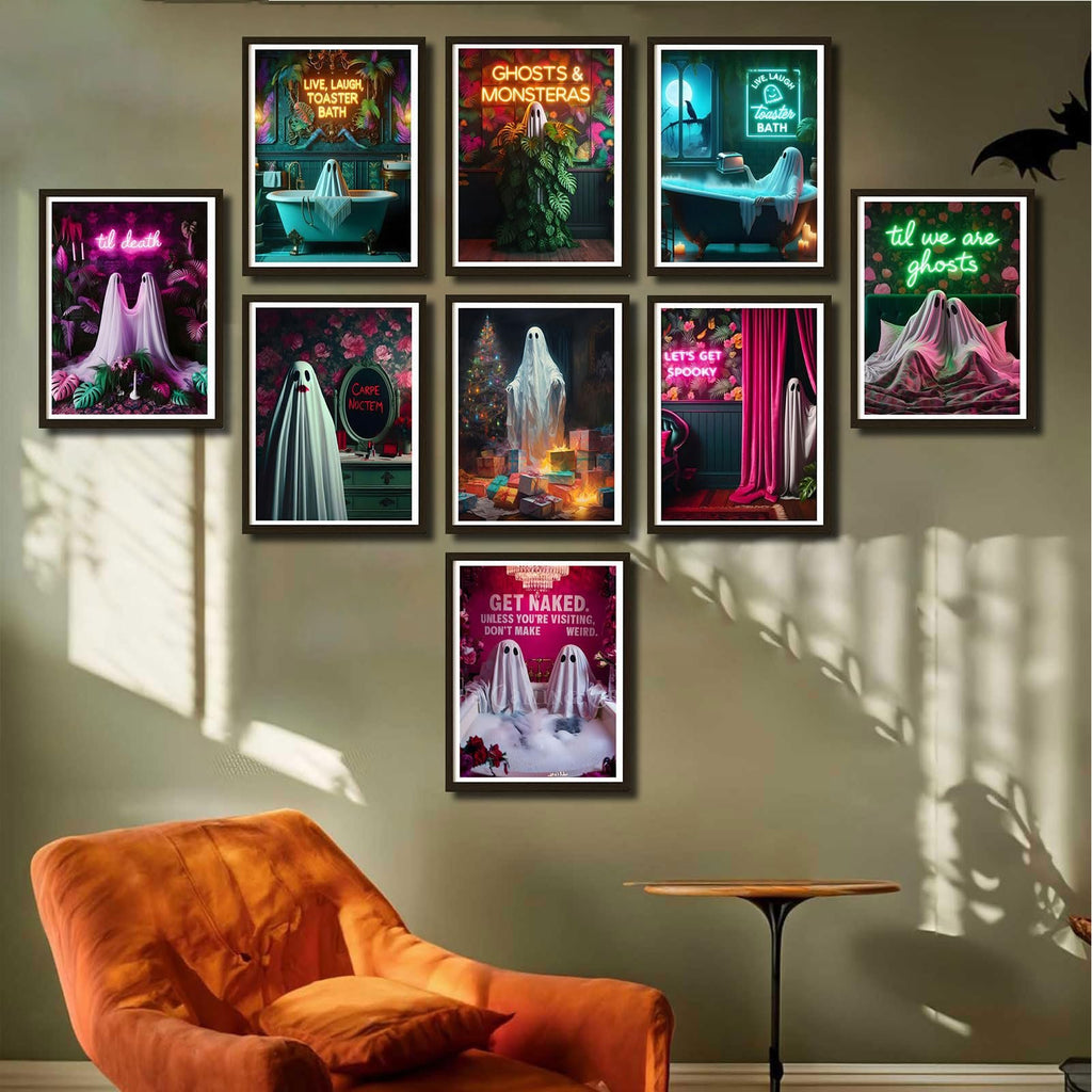 Nine Halloween ghost-themed canvas art prints displayed on a wall above an orange armchair.
