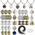 Assortment of bezel pendant trays in various shapes and finishes, with glass cabochons and necklace cords for jewelry making.