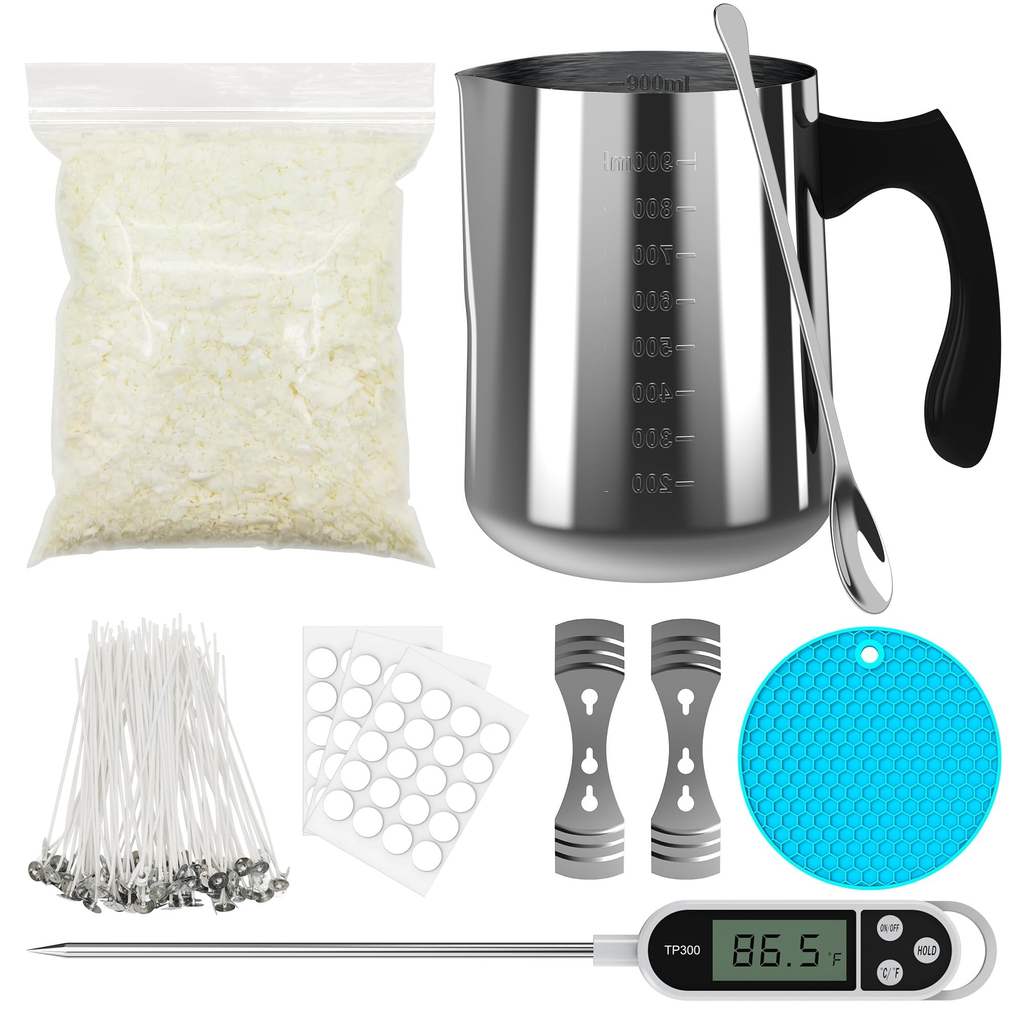Soy candle making kit contents including wax flakes, pouring pitcher, spoon, wicks, stickers, wick holders, thermometer, and silicone mat.